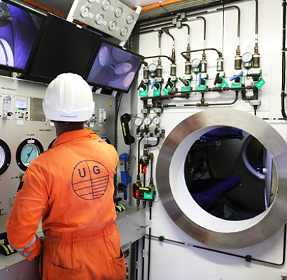 Diver inspecting a Saturation Dive System by Unique Group