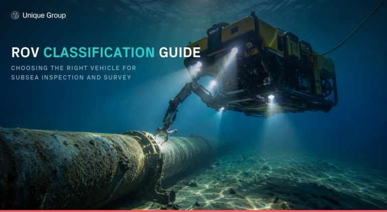 Work-class ROV using its manipulator arm to inspect a subsea pipeline, illustrating ROV classification from Unique Group