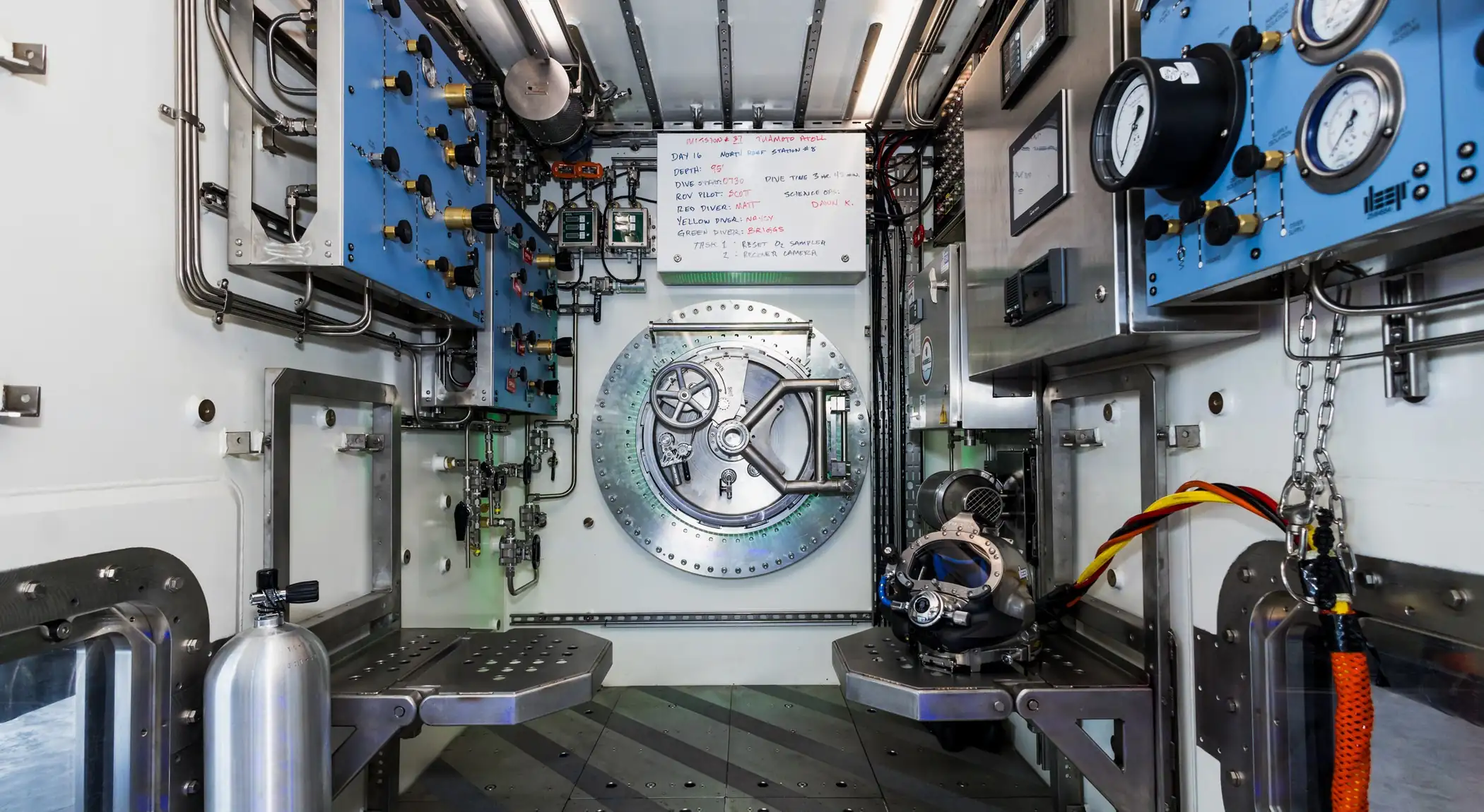 Interior of Vanguard's dive centre showing the Unique Group gas and fluid control panels either side of the entry hatch